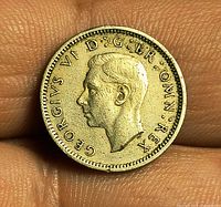 Obverse of 1951 sixpence featuring King George VI portrait