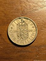 Reverse side showing crowned English shield and date 1956