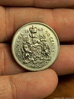 Reverse view showing coat of arms, date and denomination