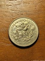 Reverse showing prairie crocus and legends MANITOBA 1870-1970 CANADA DOLLAR