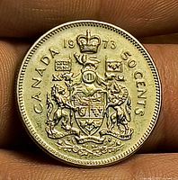 Reverse of 1973 Canada 50 cent coin showing Canadian Coat of Arms