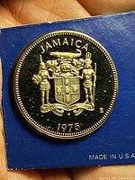 1975 Jamaica dollar coin sealed in blue cardboard