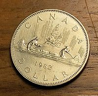 Reverse of 1982 Canada Voyageur dollar showing canoe design and date