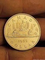 Reverse side of 1985 Canada dollar showing Voyageur design