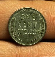Reverse of 1943 steel wheat cent showing ONE CENT legend and wheat stalks