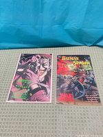 Both comics side by side, full view of covers