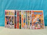 Front view of all comics lined up showing spines and partial covers