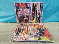 Front view showing entire lot of bagged comics, two upright rows and staggered stack