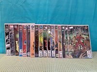 Front view of all fifteen bagged Fate series comics lined up side by side