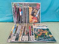 All twenty bagged Green Arrow comics spread and stacked