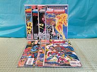 Eight bagged and boarded comics displayed, four Jonni Thunder at back, four Gambit and the X-ternals at front