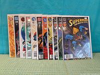 Front view showing 11 bagged comics side by side