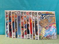 Row of eleven bagged Superman: The Man of Steel comics displayed upright