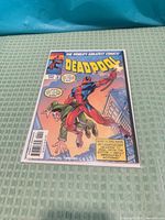 Front cover of Deadpool #11 comic showing title, artwork, issue number, price, and barcode