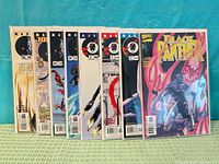 Eight bagged Black Panther comics stacked, issue numbers visible