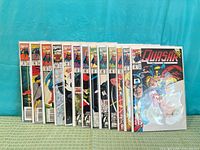 Front view of entire stack of Quasar comics displaying spines and one full cover