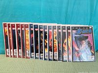 All sixteen comics aligned showing spines and bagged condition