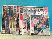 All nine comic books fanned out showing front covers