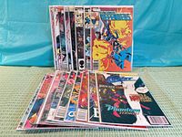 All 17 bagged comics fanned out showing cover variety