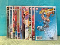 Stack of 14 bagged comic books showing spines for title and issue identification