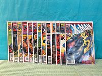 Front view of twelve bagged X-Man comics issues 49, 51-52, 54-62 in a row