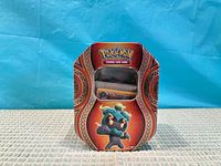 Front view of Pokémon TCG mini tin
