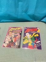 Front covers of The Atom #13 and #15