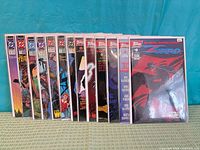 All 13 comic books lined up showing issue numbers and bagged condition