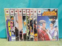Front view of all nine Archer & Armstrong issues in sleeves