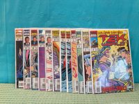 Front view of all eleven bagged comics arrayed side-by-side showing issue numbers and condition