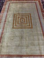 Full view of gold and orange Kashan rug