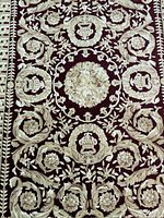 Close-up of rug showing floral pattern and colors