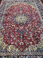 Full view of Persian Esfahan rug showing complete design and borders