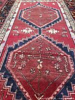 Close-up of central medallions and red field