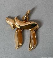 Front view of 14K yellow gold Chai pendant with bail