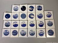 All 22 boxed coasters displayed face up showing ship images