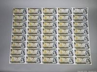 Full view of the uncut sheet displaying 5 rows by 8 columns of $1 notes