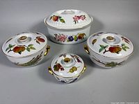 Group shot of four Royal Worcester Evesham lidded casseroles