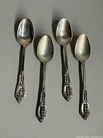 Set of four Wallace Rose Point sterling silver teaspoons