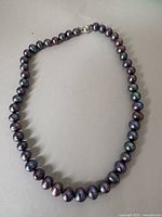 Full view of pearl necklace in looped position