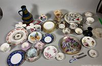 Group shot of all assorted china, pitcher, platter, figurines