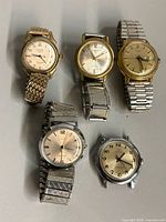 All five men’s watches displayed together