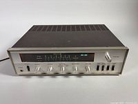 Front angled view of Belcor receiver showing full face and top