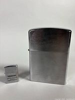 Front view showing both lighters together for size comparison