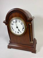 Front angled view of wooden mantel clock