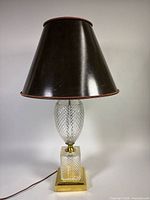 Entire lamp showing crystal body, brass base, black shade