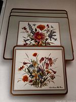 Stack showing front design and edges of four placemats