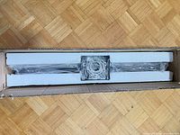 Vanity light inside original box with foam packaging