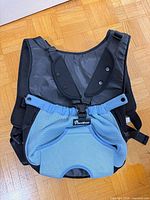 Front view showing blue mesh pouch, Pawaboo logo, leg openings, black upper panel