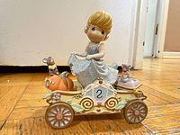 Front view Cinderella figurine on coach